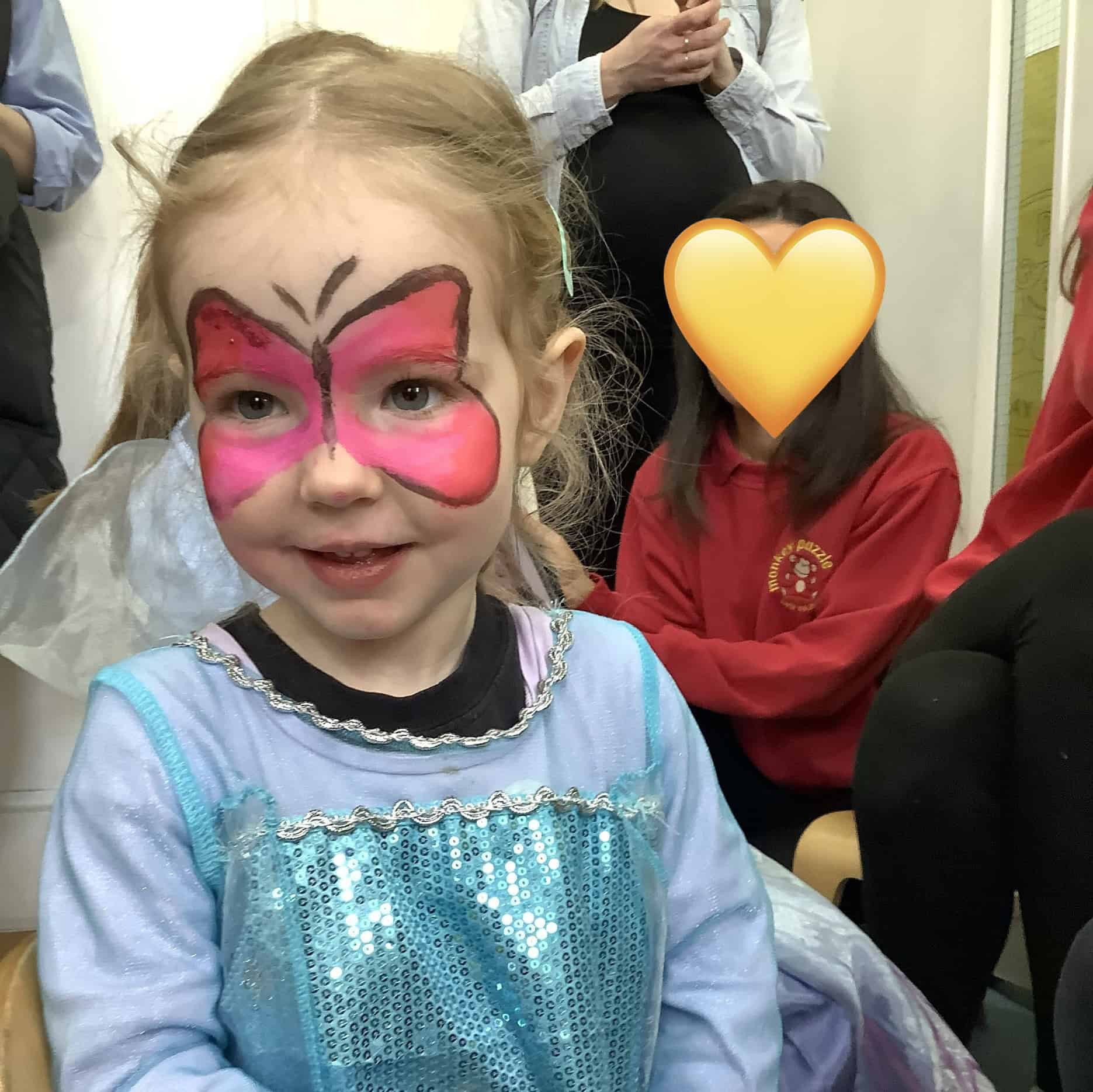 Young girl with butterfly face paint